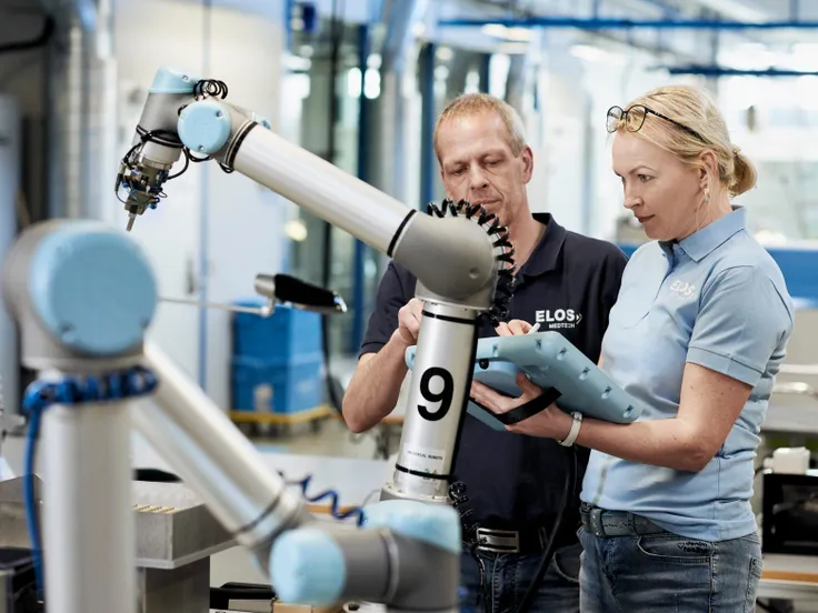 Team working with a collaborative robot